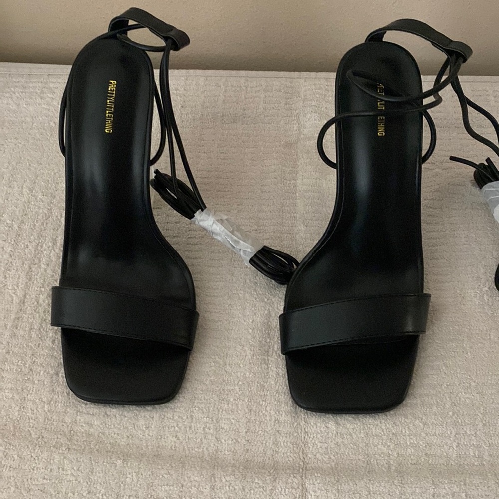 Black and clear lace up high heel shoe